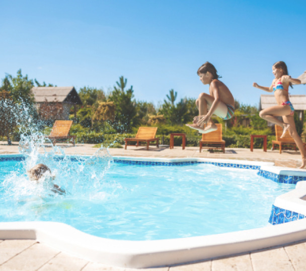 cheerful-children-rejoicing-jumping-swimming-pool